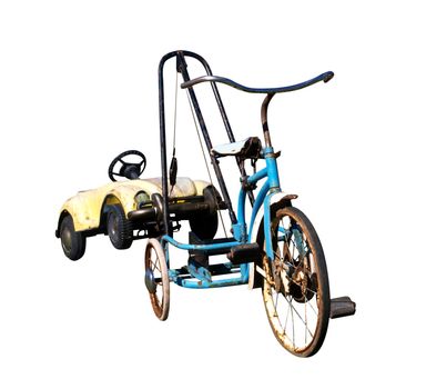 Trike with a Toy Car in Tow isolated with clipping path      