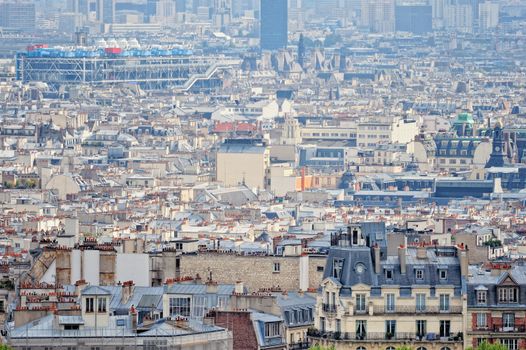 Aerial panorama above houses rooftops in a Paris