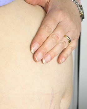 a pregnant woman with her hand on the stomach