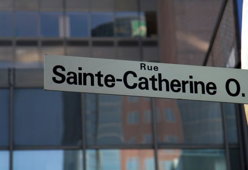 A street sign for Sainte-Catherine street in Montreal, Quebec, Canada.