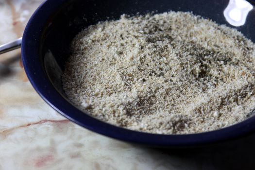 Spices and bread crumbs for breading meat.