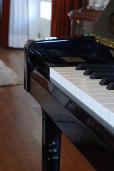 photo of a piano in a classic living room