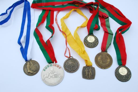 photo of a collection of medal awards from a sport competition