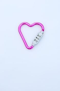 photo of a heart shaped violet carabiner with lockpad