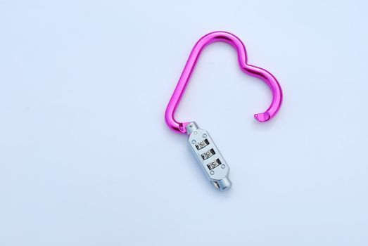 photo of a broken heart shaped violet carabiner with lockpad