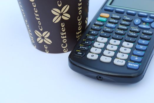 concept photo of a coffee mug and calculator