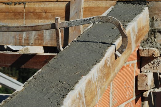 roof house under construction (cement and brick wall)