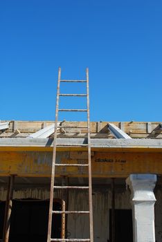 photo of a ladder to get to roof house under construction