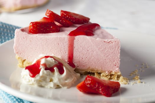 Strawberry mousse piel with whipped cream and fresh strawberries