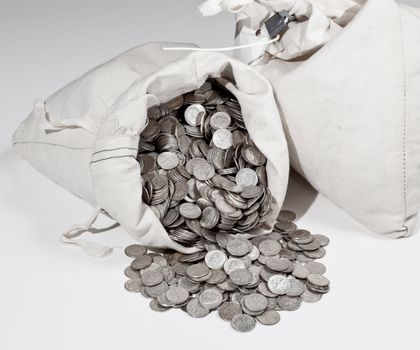 Linen bag of old pure silver coins used to invest in silver as a commodity