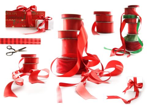 Different sizes of red ribbons and gift wrapped boxes on white background