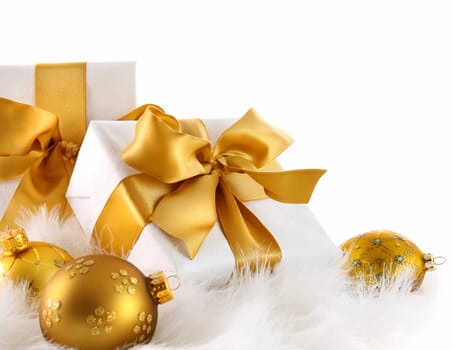 Gold ribbon gifts with christmas balls in white
