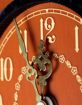 Closeup view of antique clock face. Last minutes before midnight.