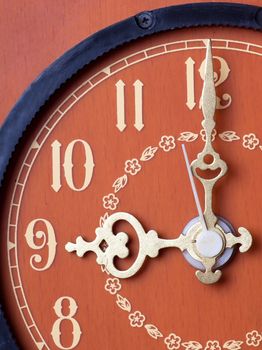 Closeup view of antique clock face. Nine o`clock.