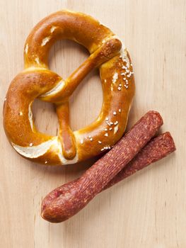 An image of a nice pretzel and sausage