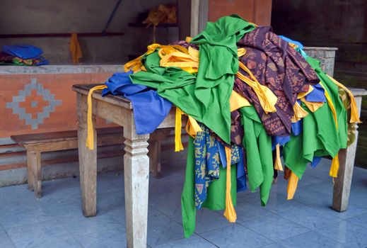 Hindu colorfull ceremony cloths pile over a table