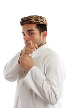 Ethnic man pointing his finger at you or something else.  He is dressed in cultural clothing.  White background.