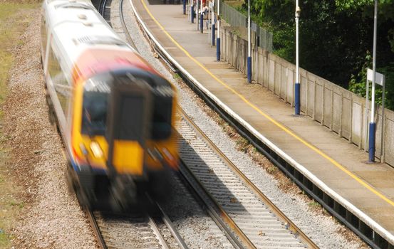 speeding train traveling through a station