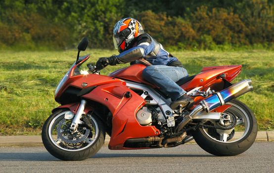 motorcycle rider cornering at speed