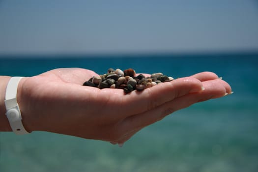 Handful of stones in hand