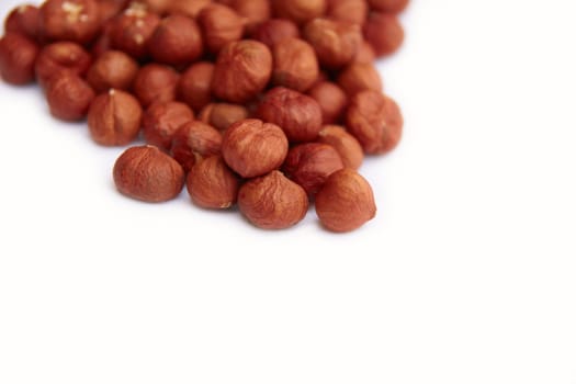 Close-up of hazelnuts on white background
