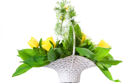 White basket full of tulips, with white pigeon and lilies of the valley.