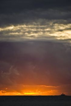 fabulous sunset with many clouds over the ocean