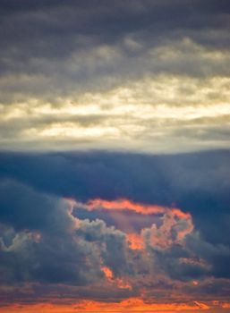 fabulous sunset with many clouds over the ocean