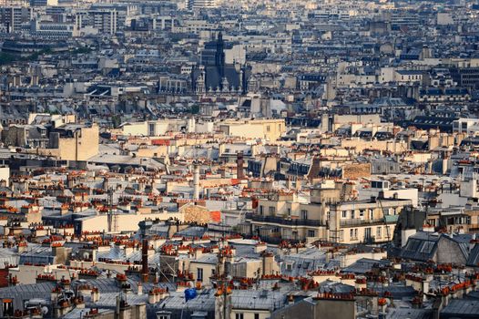 Aerial panorama above houses rooftops in a Paris
