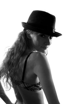 Woman with hat in shadow, black and white image