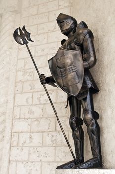 Image of a standing medieval knight armor.