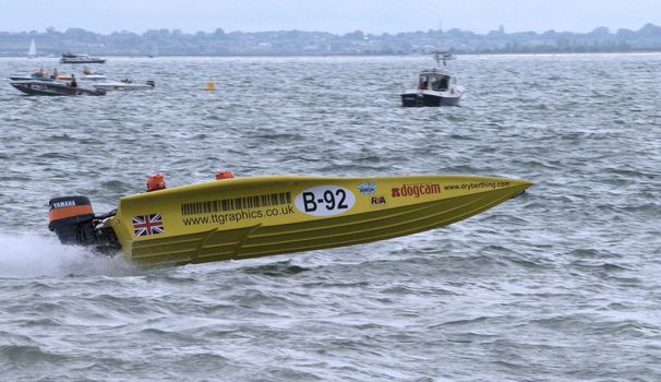 Yellow speedboat racing