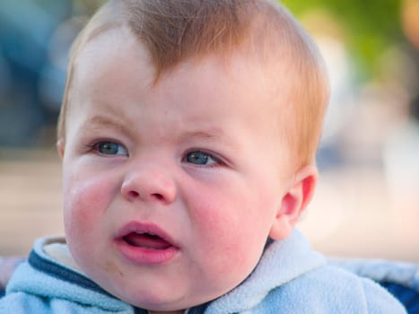 Cute little baby boy with an expression