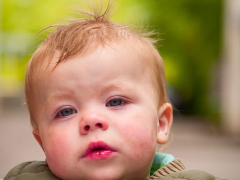 Cute little baby boy showing an expression