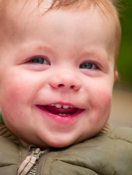 Happy little  baby boy laughing with joy