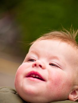 Cute baby boy laughing happily