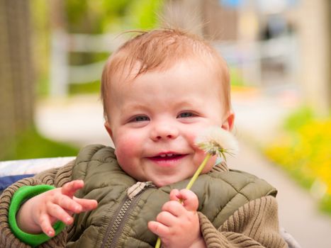 Sweet baby boy laughing happily