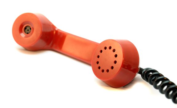 Red handset of an old telephone.