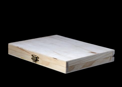 Empty thin wooden box on a black background.