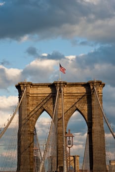 detail of western bridge standard with american flag on top.  new york city