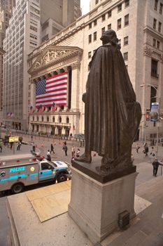 statue of George Washington on steps of Federal Hall (where was sworn in as president), and the New York Stock Exchange; on Wall Street, NYC