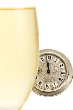 old pocket watch behind a cold glass with champagne isolated on white background