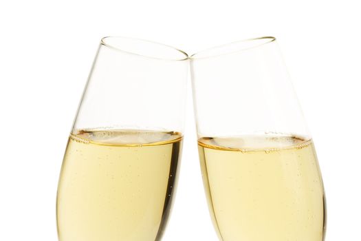 closeup of two aslope glasses with champagne isolated on white background