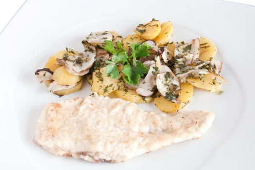 chicken escalope with baked potatoes and mushrooms isolated on white with clipping path