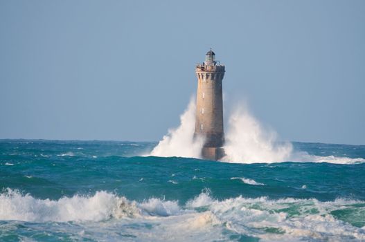 Lighthouse called "Le phare du four" in Tremazan in Brittany, France during storm in November