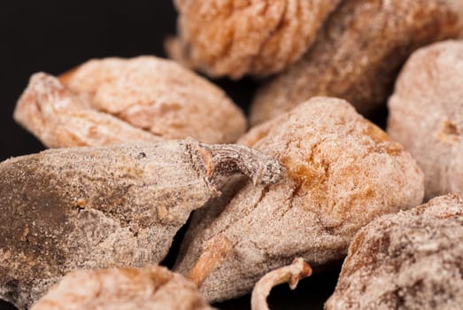 A stack of dried figs, food background