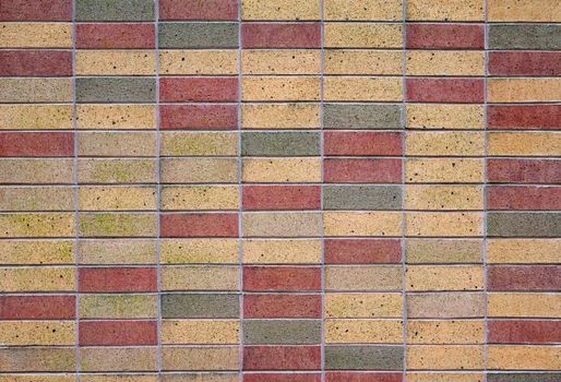 Brick wall with the colors of tan green and red