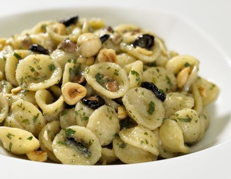 pasta plate with nuts isolated on white