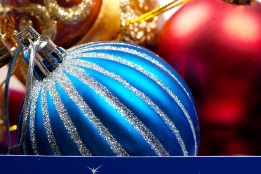 Colorful christmas decorations in a box