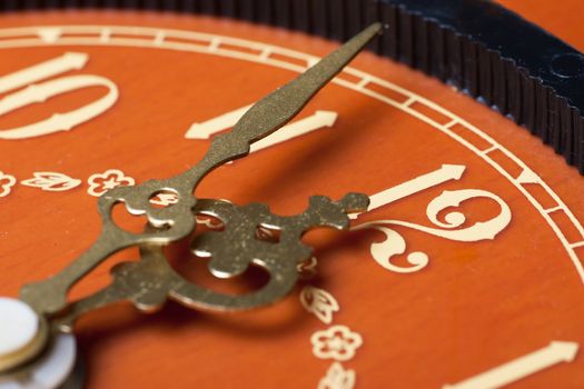 Closeup view of antique clock face. Last minutes before midnight.